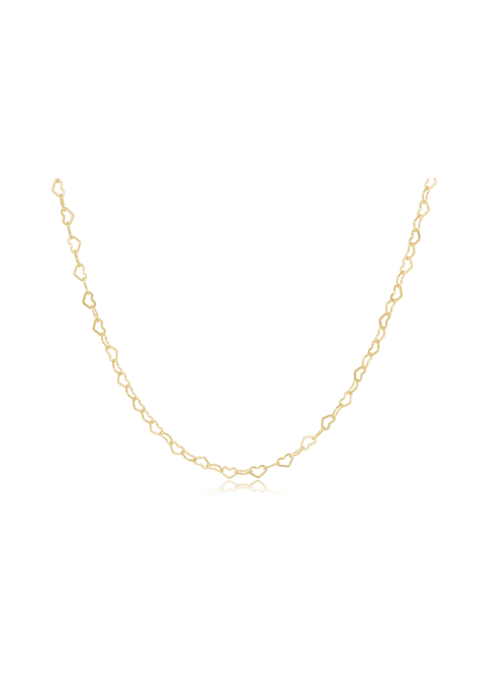 Gold heart shaped chain choker necklace on a white background