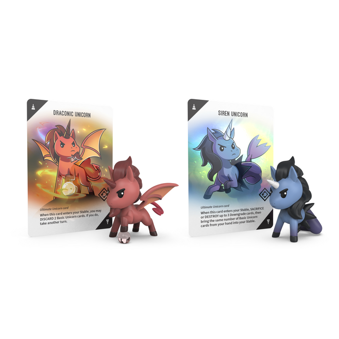 Two vinyl mini figures from the Ultimate Unstable Unicorns: Vinyl Figure Blind Box by Unstable Games stand proudly with their cards: a red winged unicorn on the left and a blue horned one on the right, each card showcasing unique features.