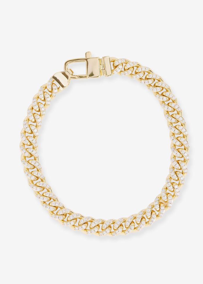 Gold chain bracelet with pave CZs on a white background