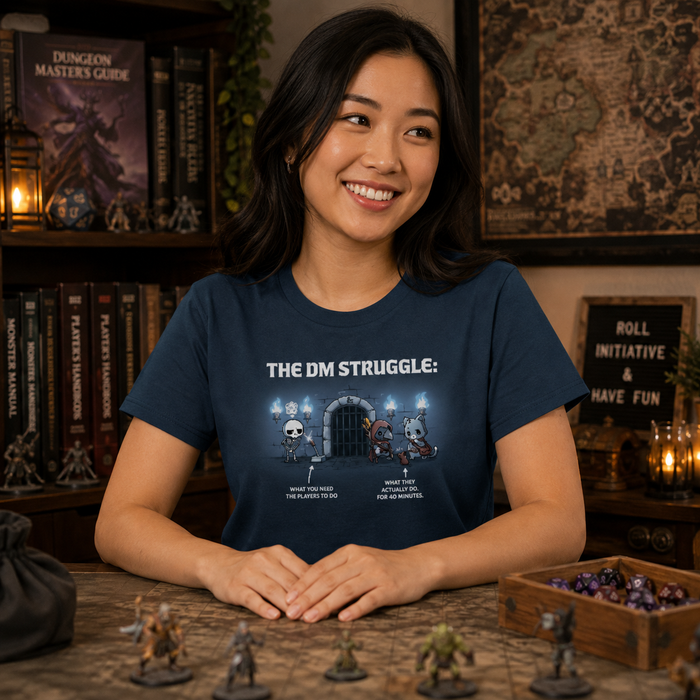 Women's Premium T-Shirt_TeeTurtle denim blue The DM Struggle Premium Cotton T-shirt featuring a grumpy skeleton standing next to a glowing lever and two player characters nearby talking to a rat. Under the skeleton is the text "what you need the players to do" and under the players is the text "what they actually do. for 40 minutes."